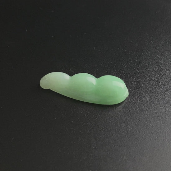 A pale green fortune pod loose jadeite.