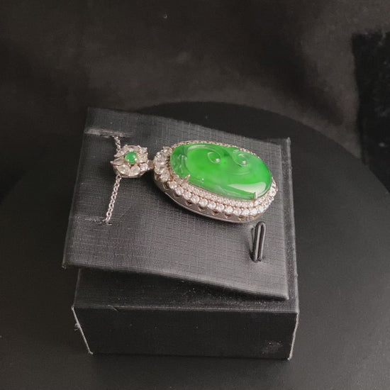 A vivid green spirit Ruyi jadeite pendant.