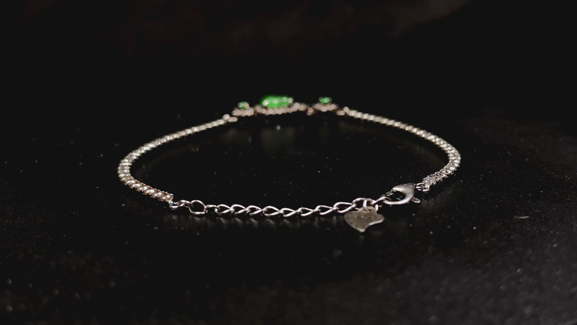 A verdant hulu fortune jadeite bracelet.