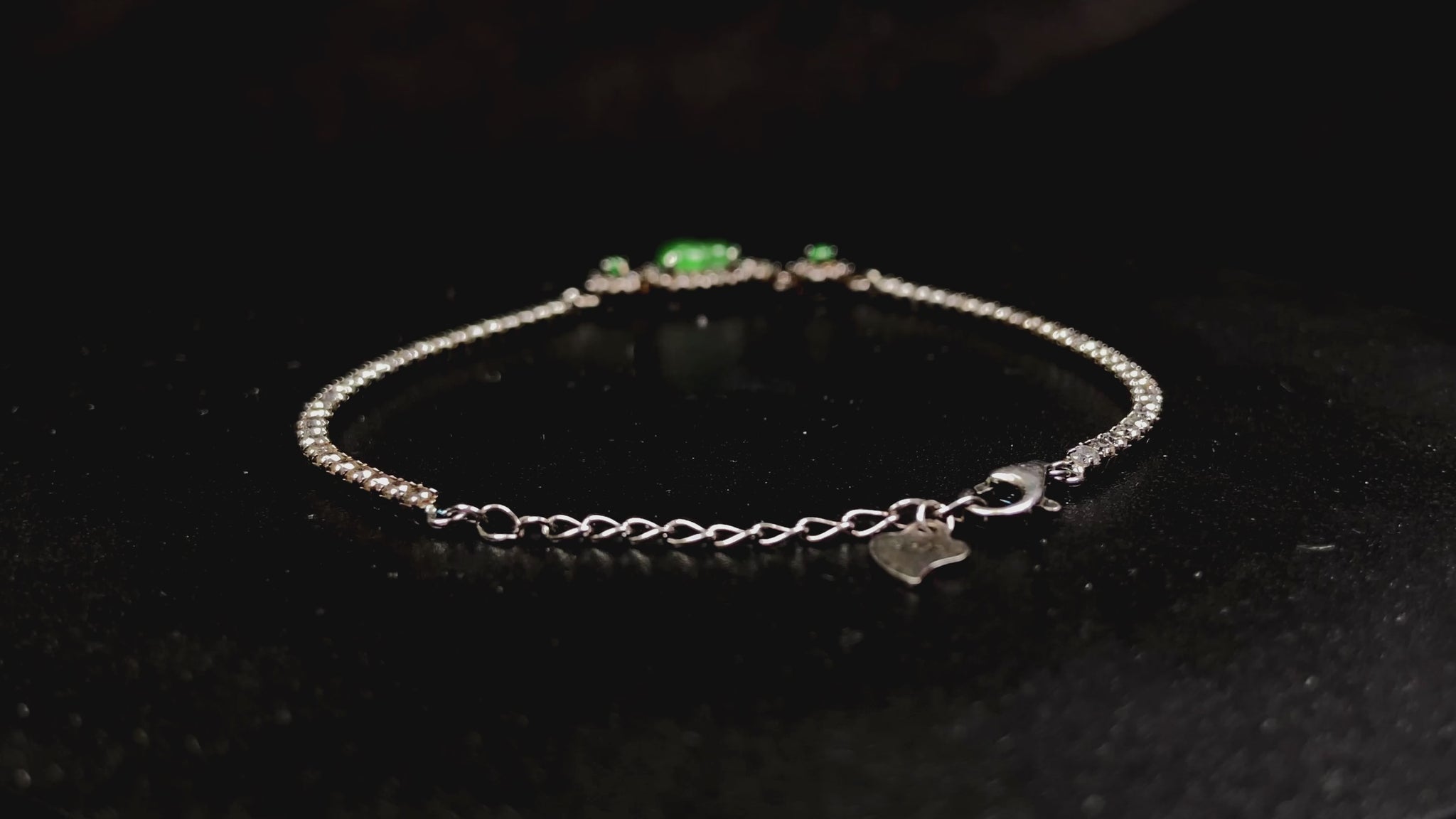 A verdant hulu fortune jadeite bracelet.