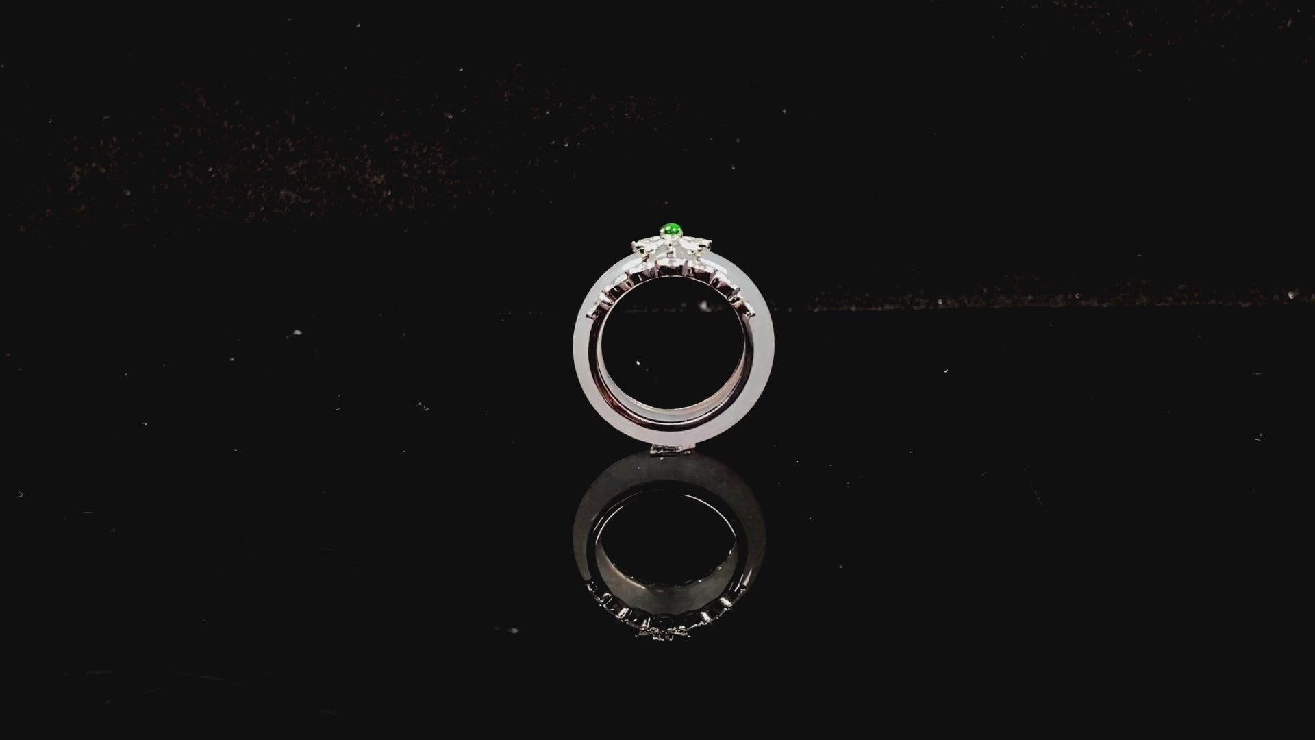 A icy white with green accent jadeite ring.