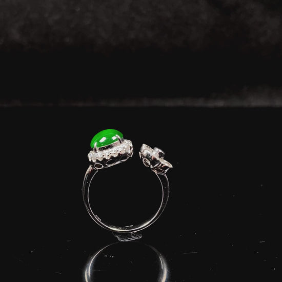 A vivid imperial green halo jadeite ring.