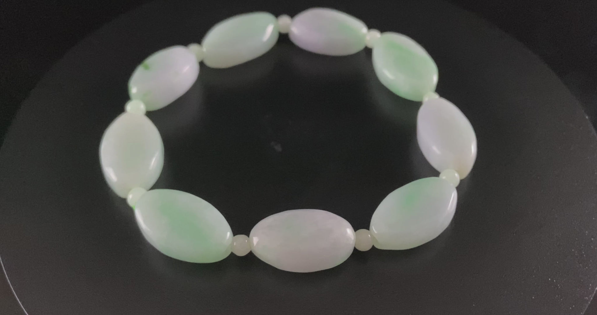 A soft mint cval jadeite beads bracelet.