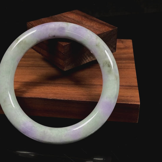 A intermingled green and lavender purple jadeite bangle.
