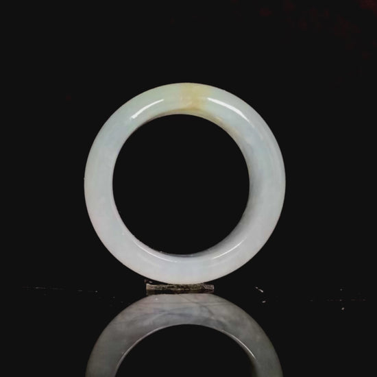 A pale celadon with a hint of yellow  jadeite ring.