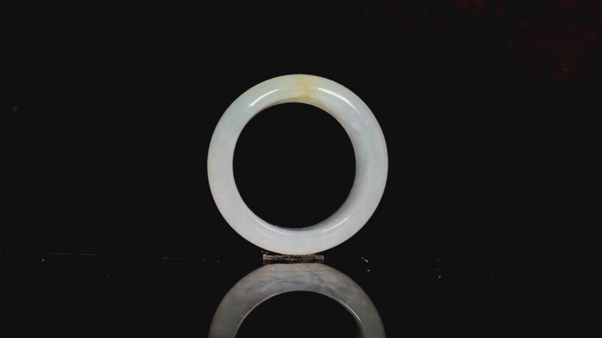 A pale celadon with a hint of yellow  jadeite ring.