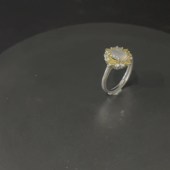 A moonlit oval flower jadeite ring.