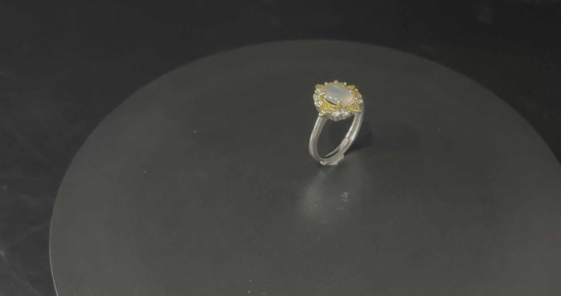 A moonlit oval flower jadeite ring.