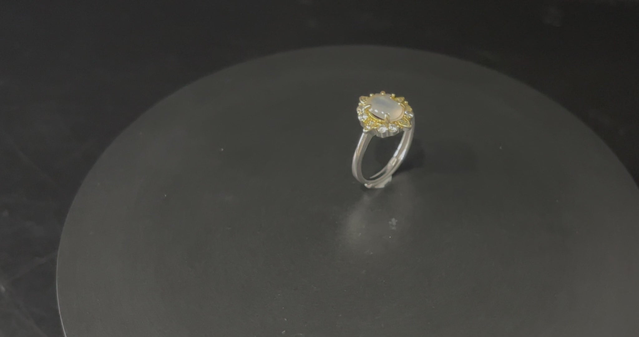 A moonlit oval flower jadeite ring.