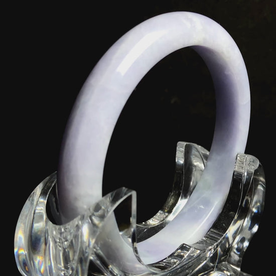 A soft lavender cloud jadeite bangle.