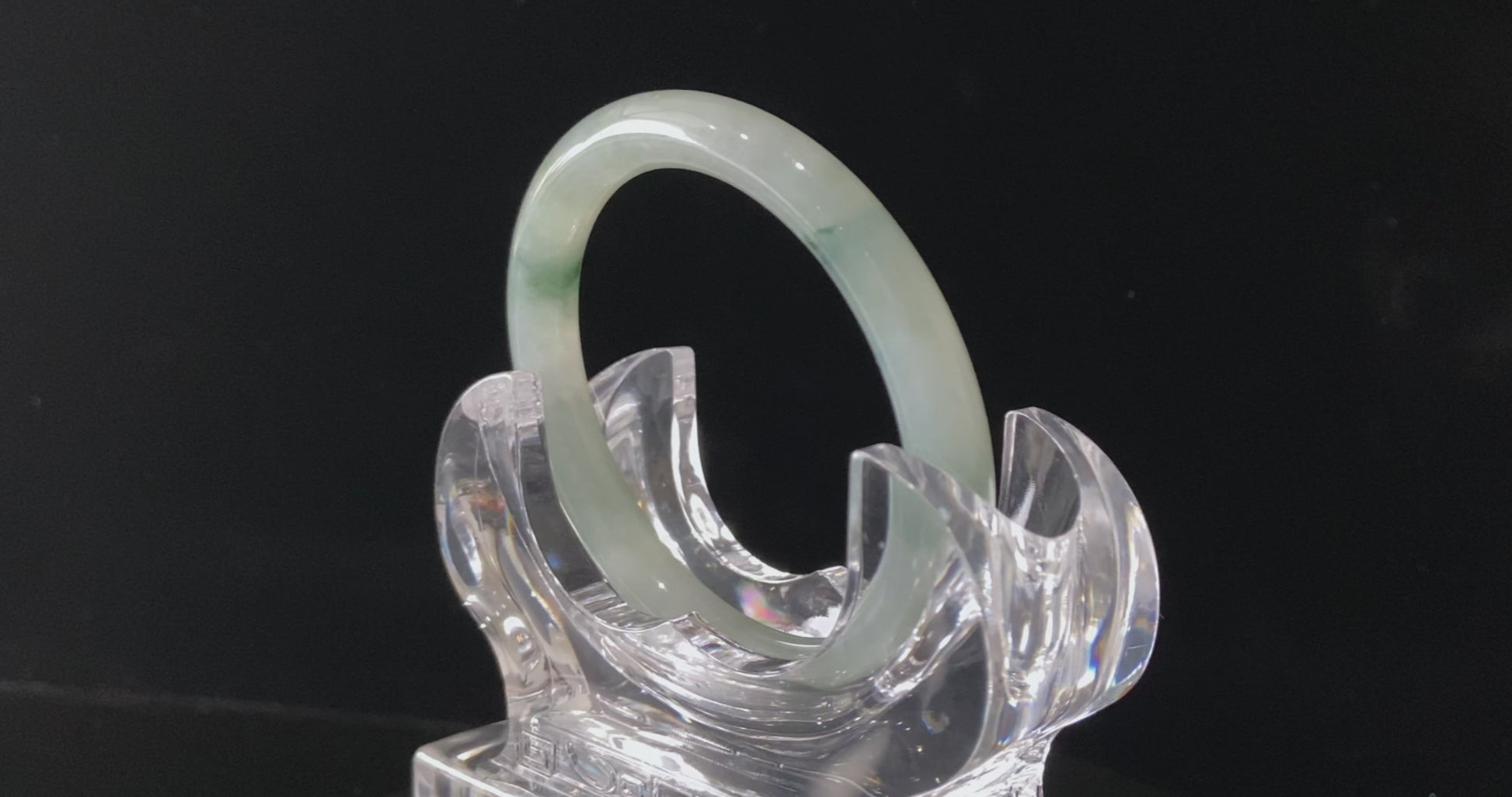 A floating blue ink jadeite bangle.