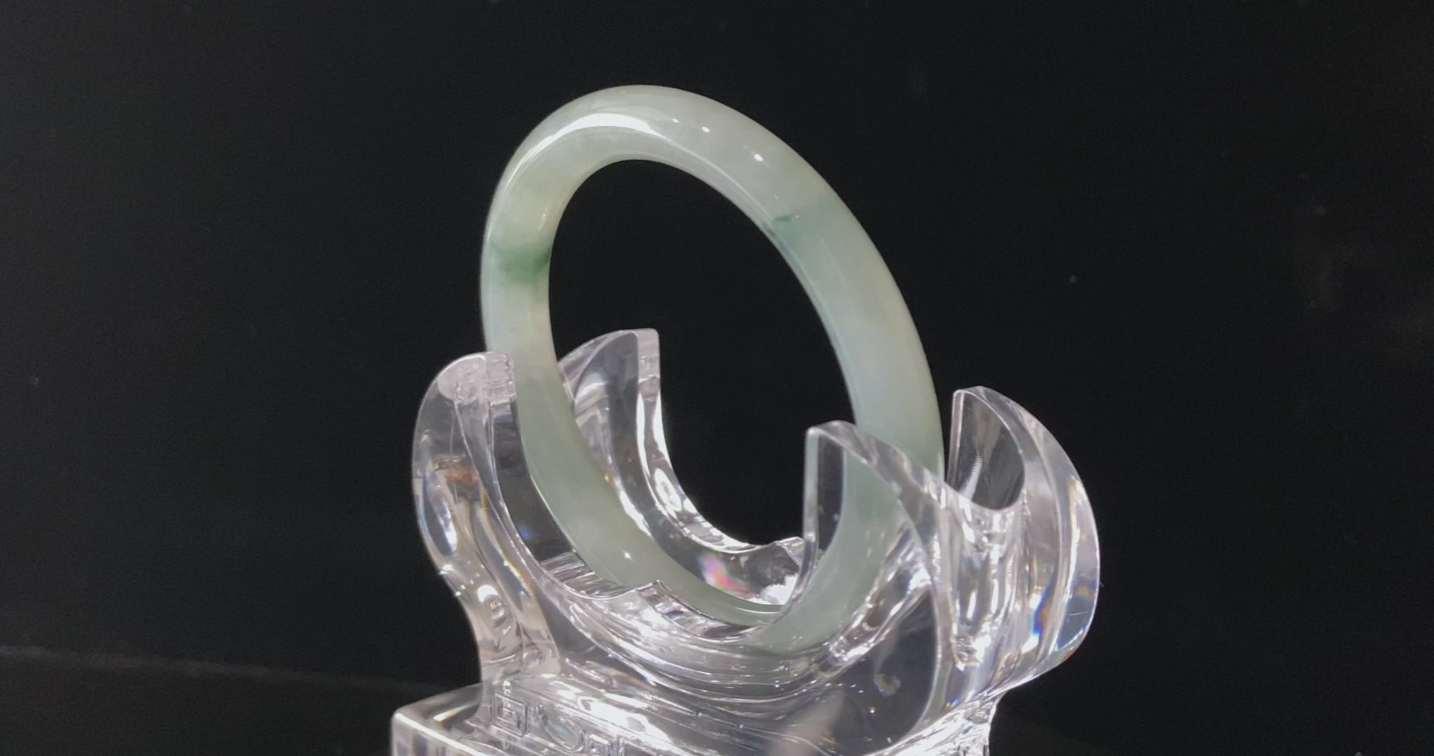 A floating blue ink jadeite bangle.