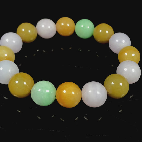 A yellow green purple jadeite beads bracelet.