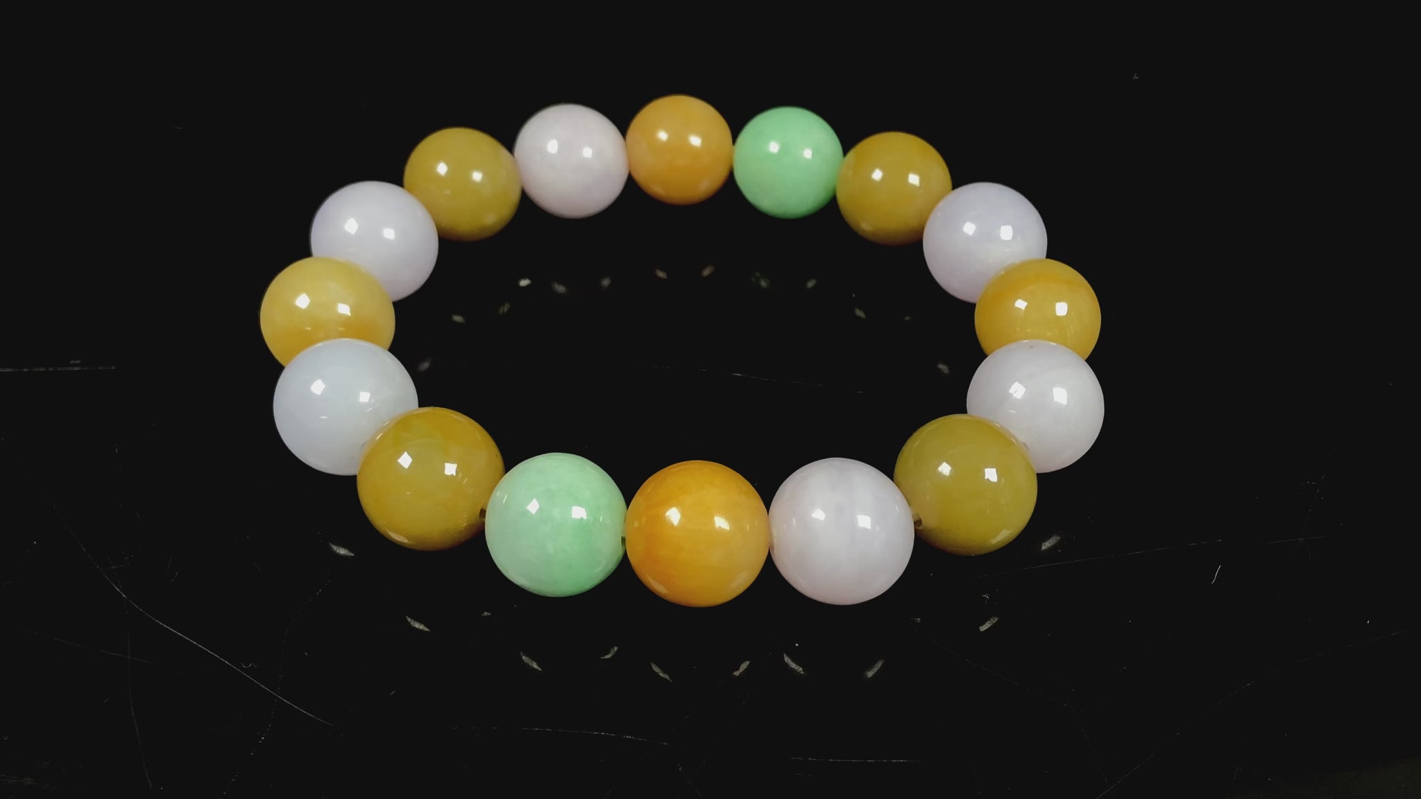 A yellow green purple jadeite beads bracelet.