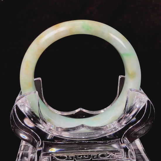 A moss honey jadeite bangle.