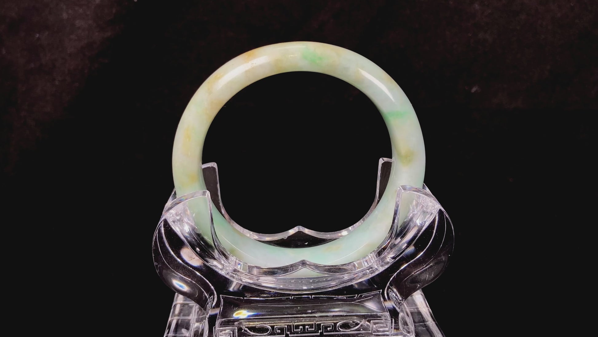 A moss honey jadeite bangle.