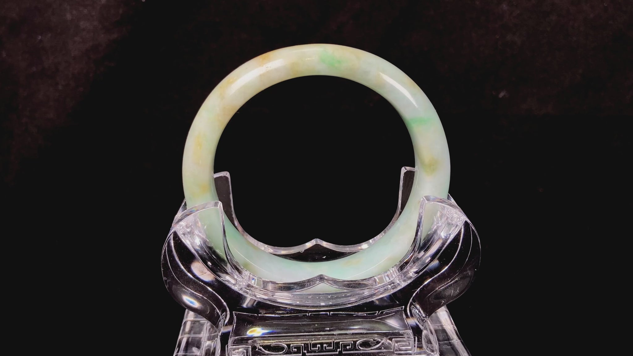 A moss honey jadeite bangle.