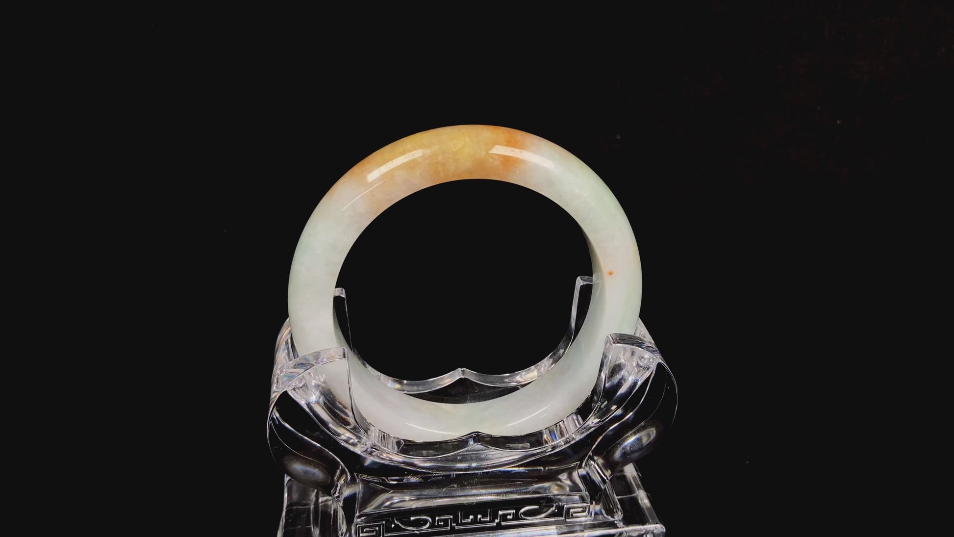 A light fernery gilded mist jadeite bangle.