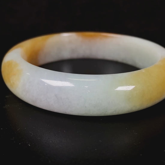 A honeyed frost jadeite bangle.