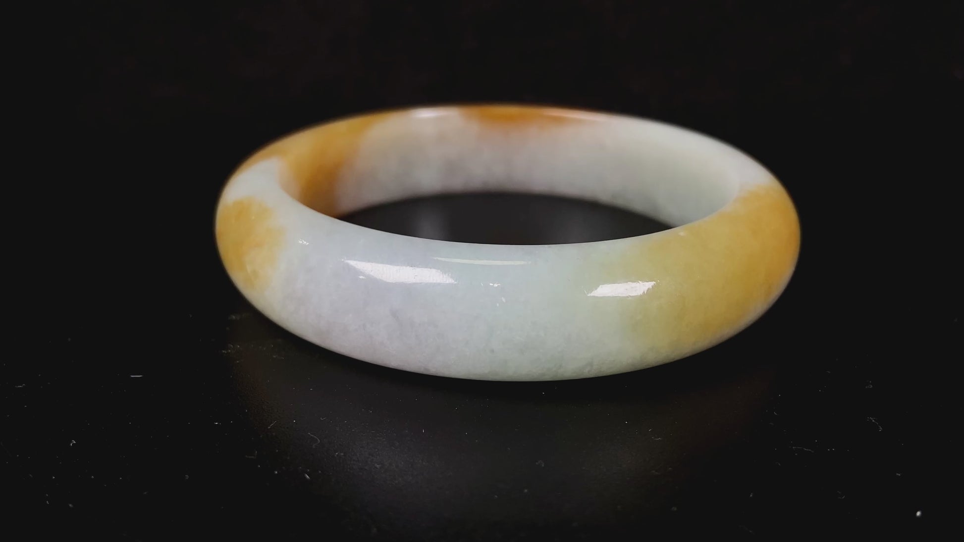 A honeyed frost jadeite bangle.