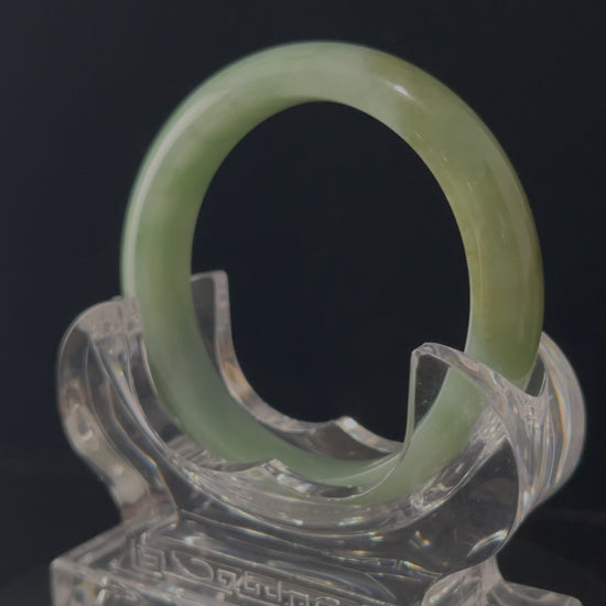 A frosted fern hue jadeite bangle.