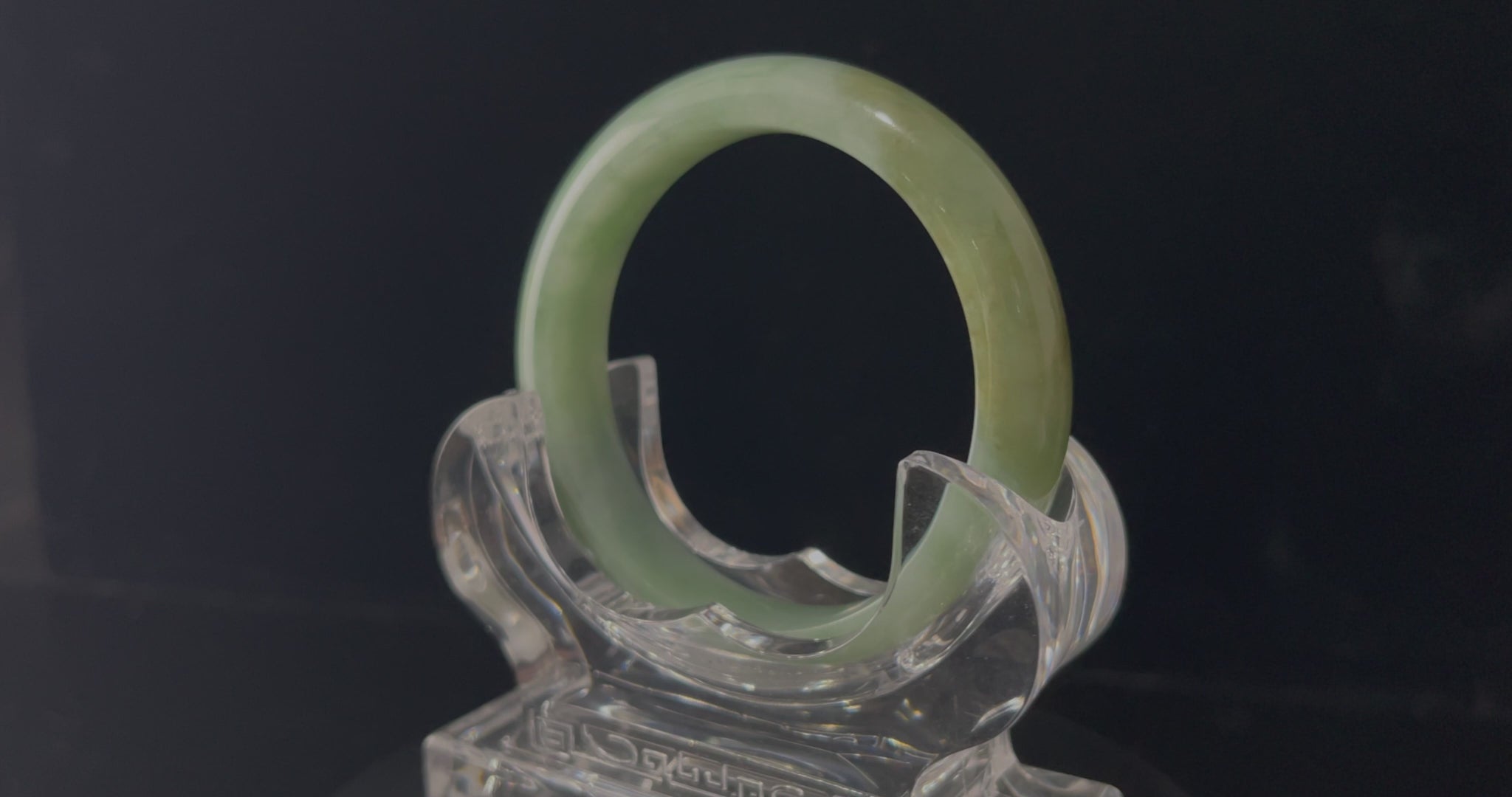 A frosted fern hue jadeite bangle.