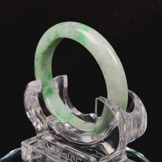 A misty bamboo green jadeite bangle.