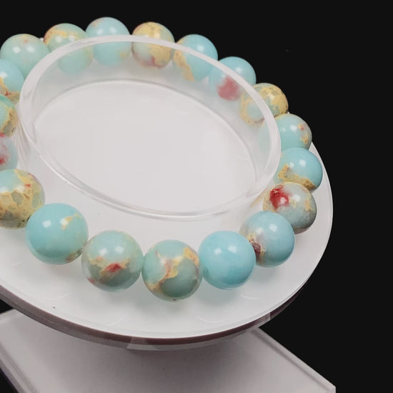 A red whispers in blue and white Shoushan stone beaded bracelet.