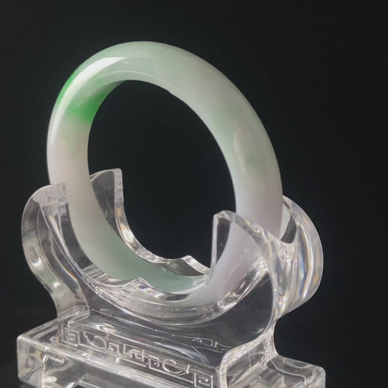 A lavender mint vein jadeite bangle.