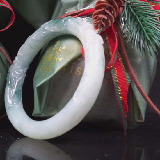 Milky white with blue green veins and floral carvings Jadeite Bangle.