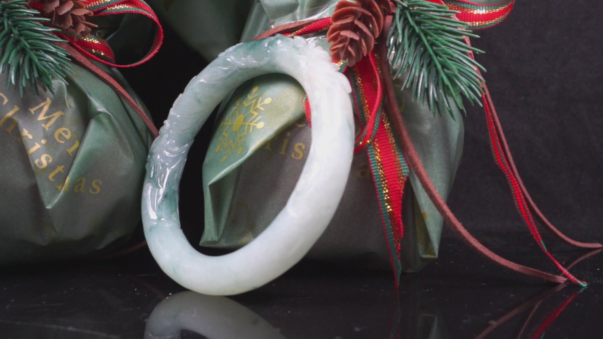 Milky white with blue green veins and floral carvings Jadeite Bangle.