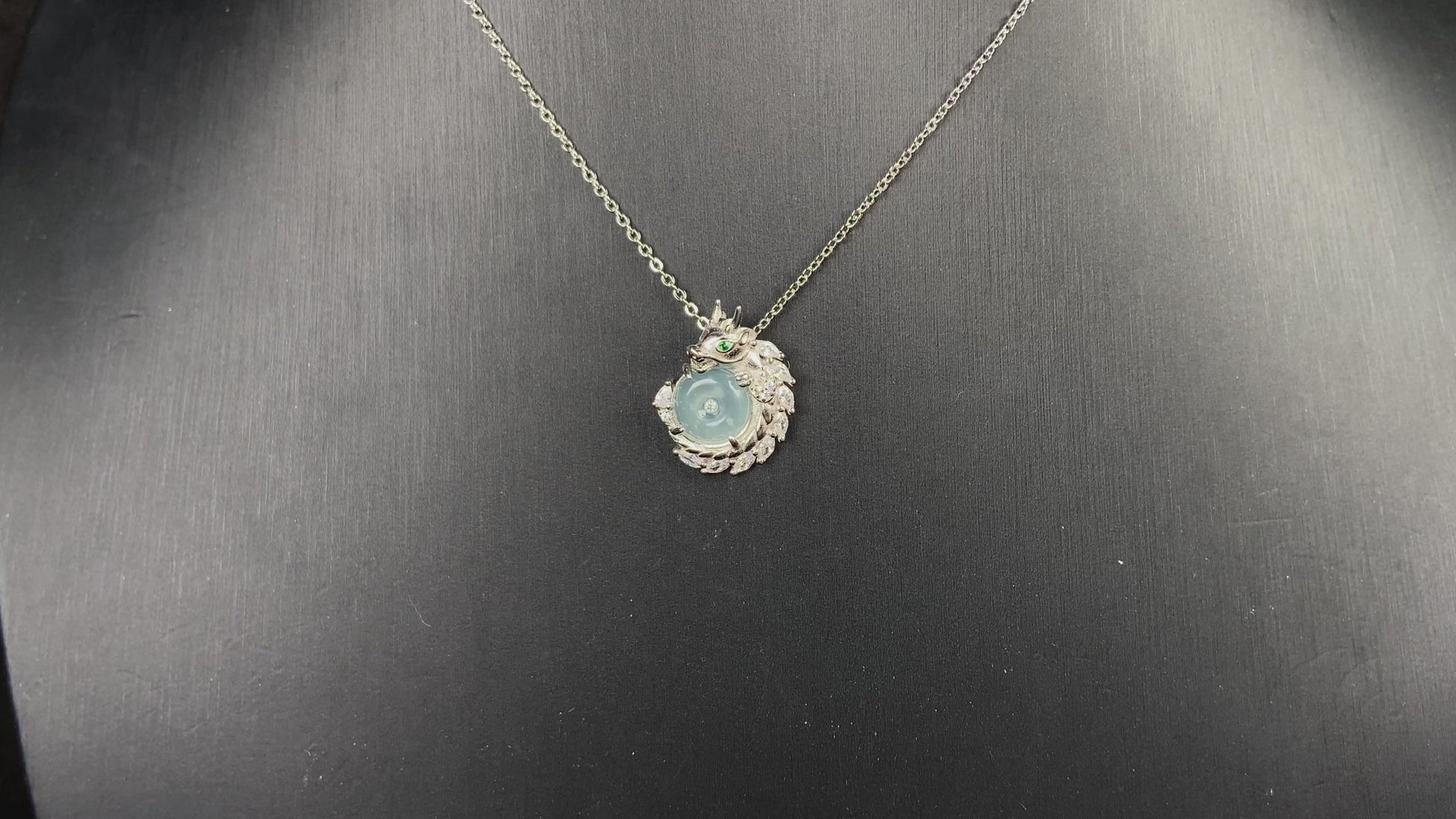 A azure dragon guard jadeite pendant.