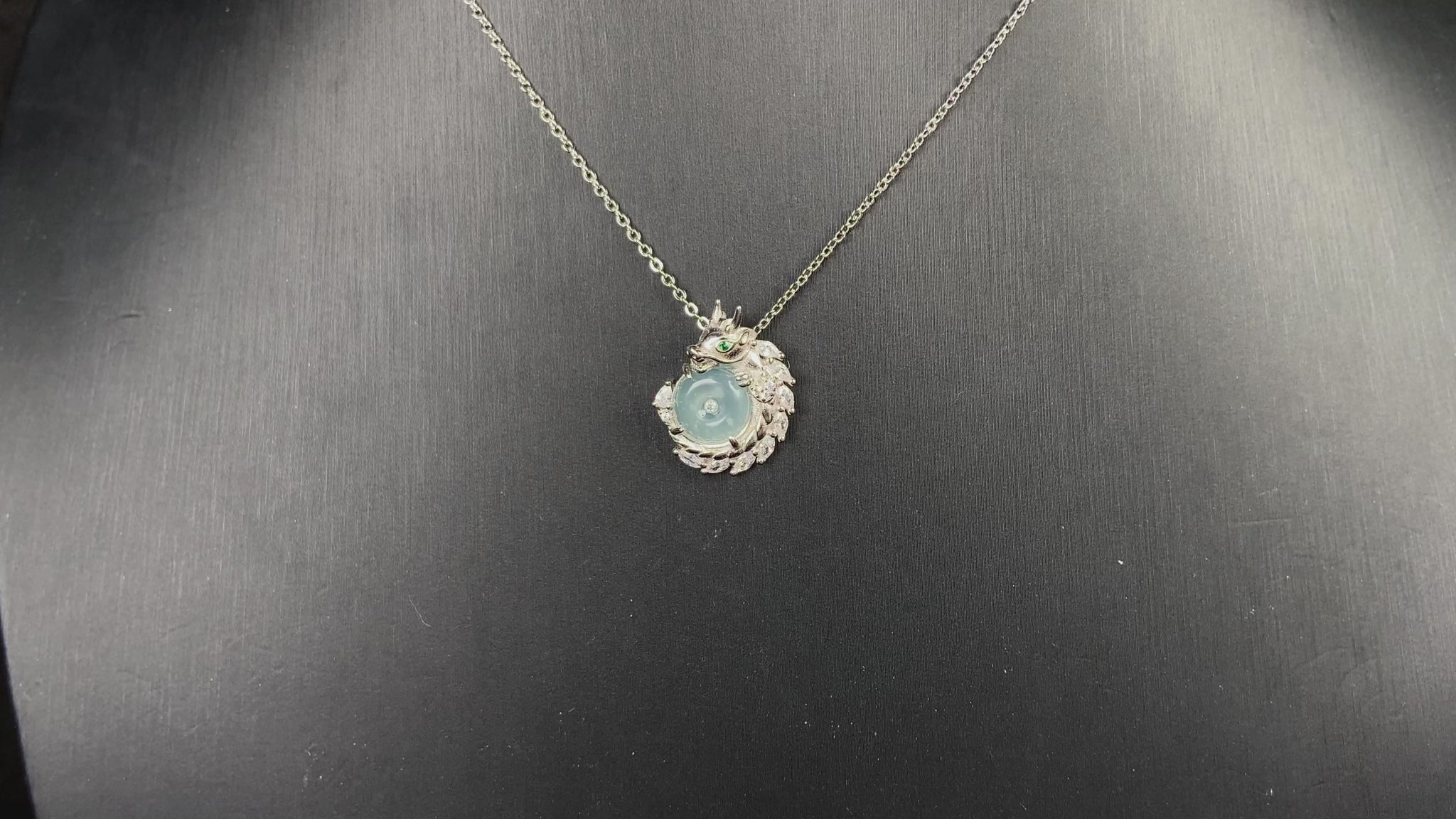 A azure dragon guard jadeite pendant.