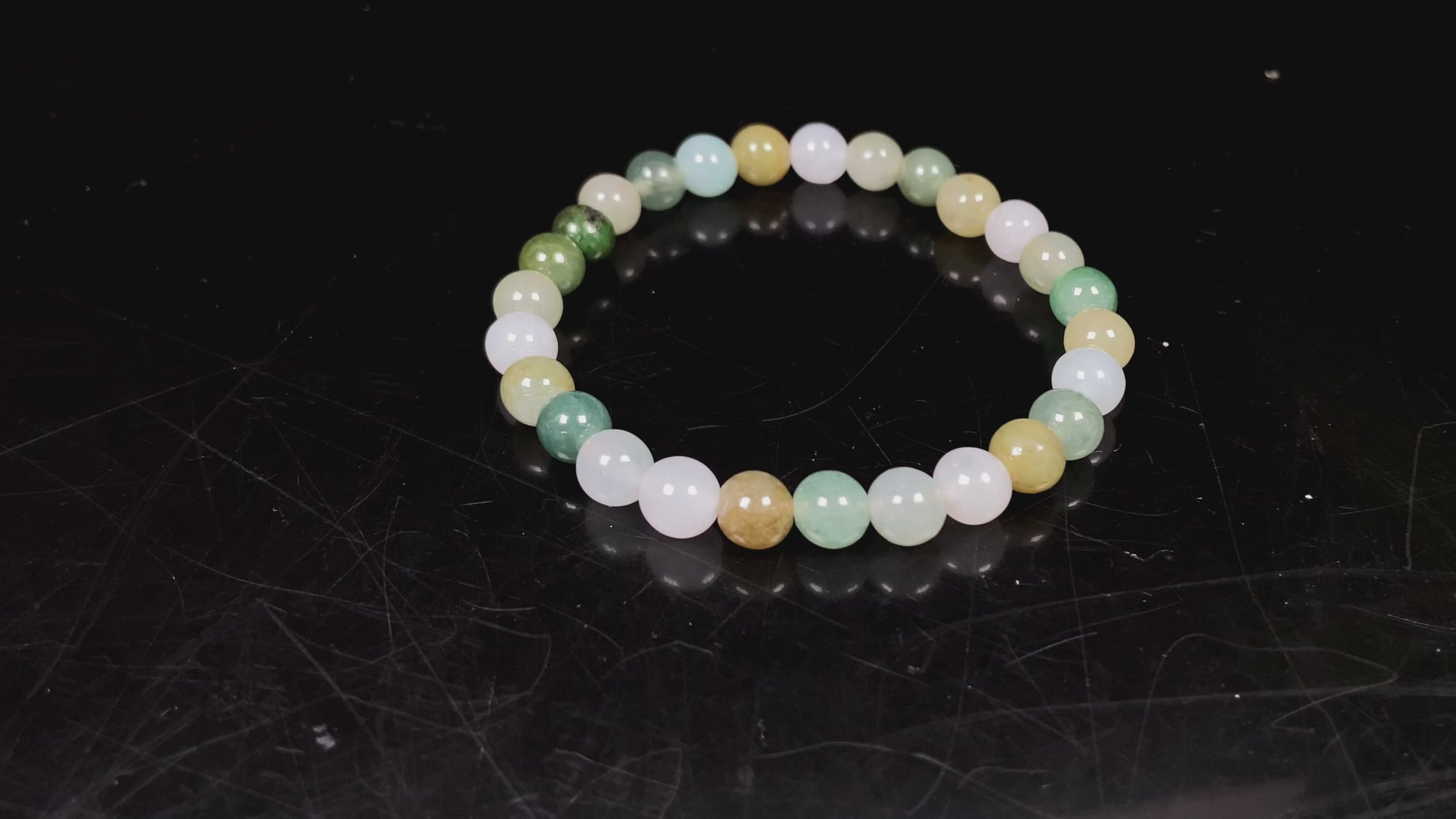 A pastel green mix jadeite beads bracelet.