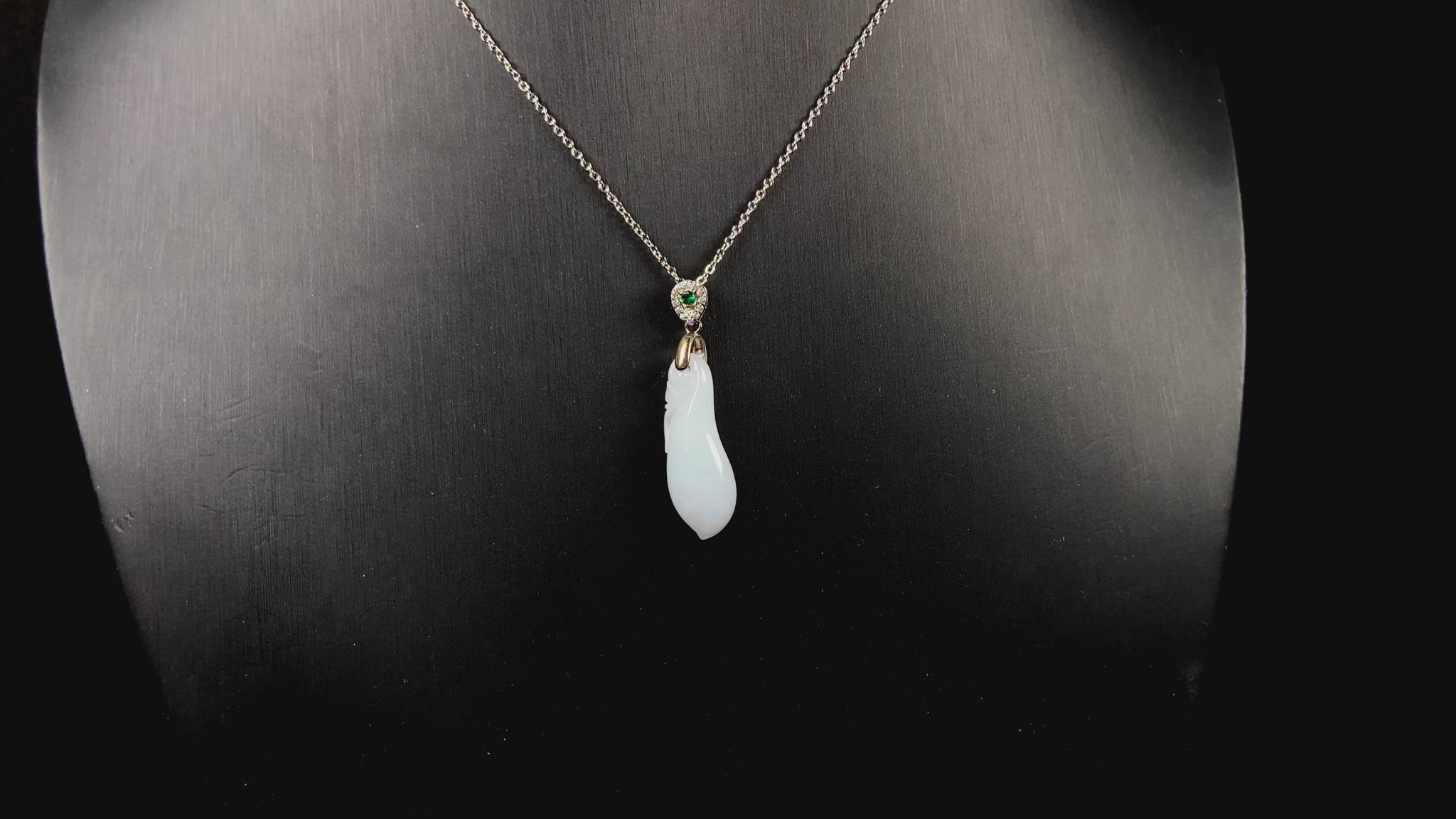 A white green smooth fortune melon naJadeite pendant.