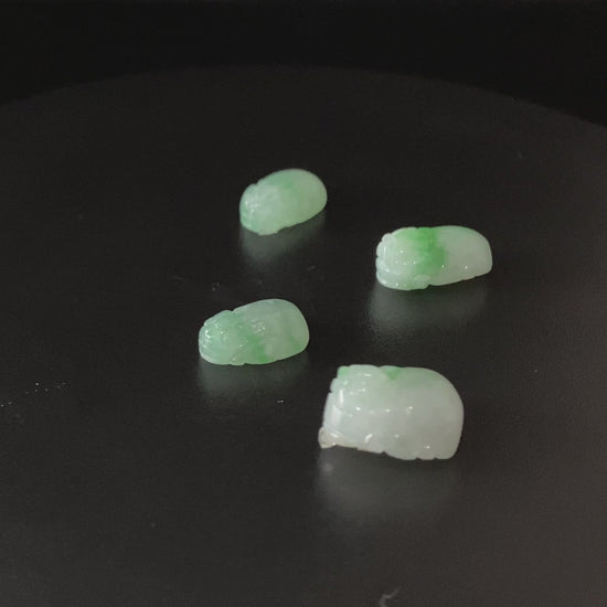 A green dot fortune Pixiu loose jadeite.