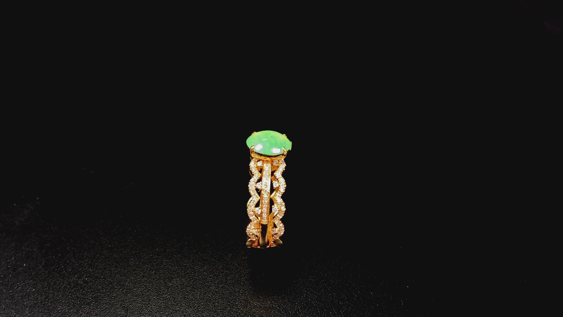 A golden wave apple hue jadeite ring.