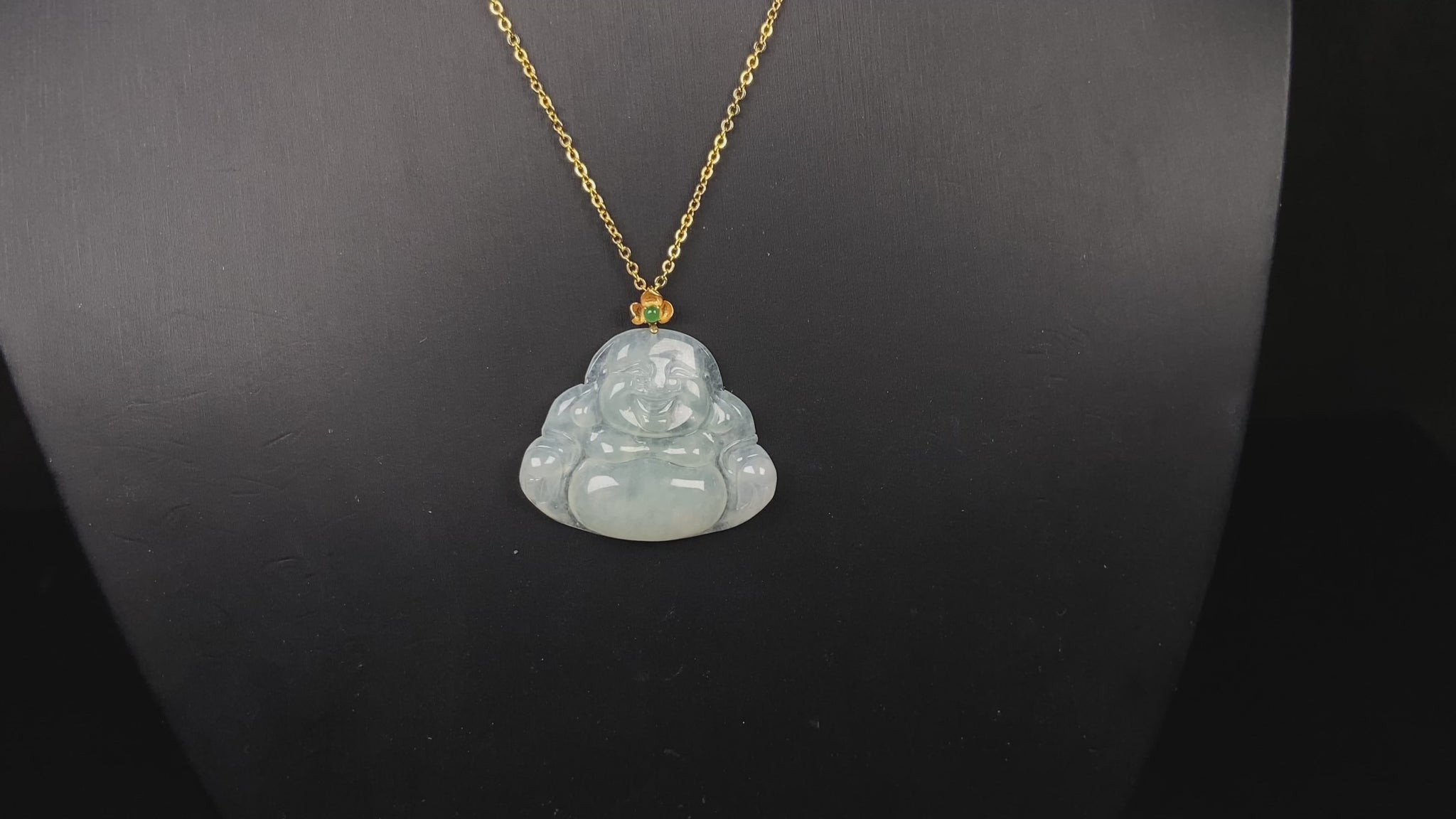 A icy pale green Maitreya jadeite pendant.