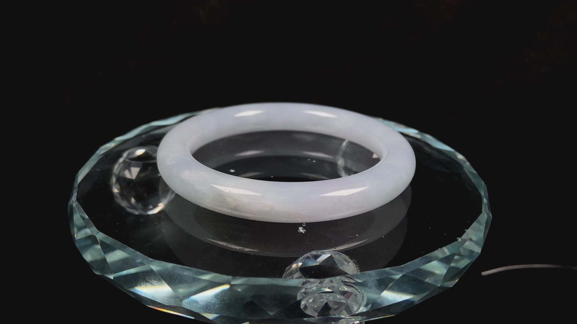 A lunar white blue green jadeite bangle.