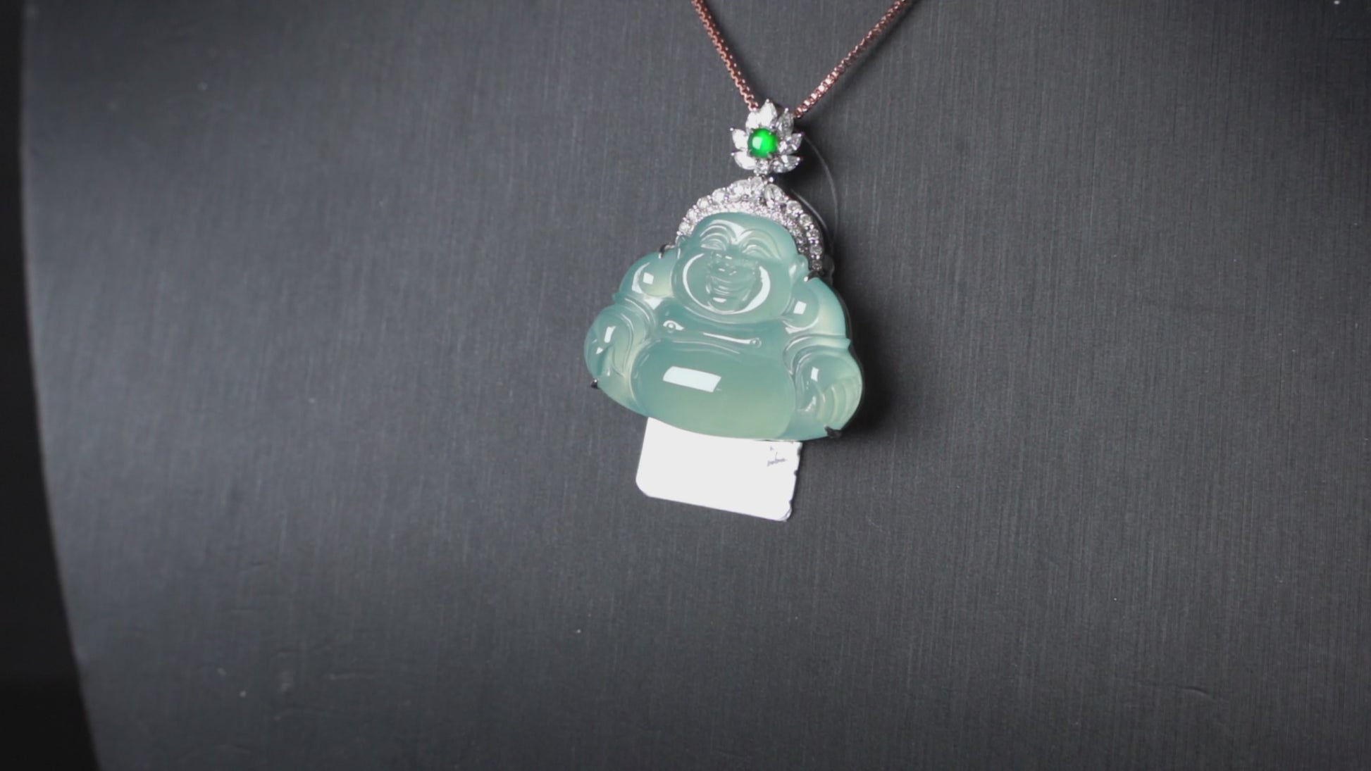 A icy blue laughing buddha jadeite pendant.