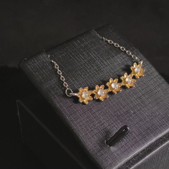 A daisy dew bloom jadeite necklace.