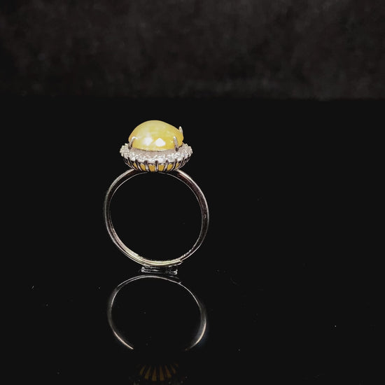 A warm honeyed glimmer jadeite ring.