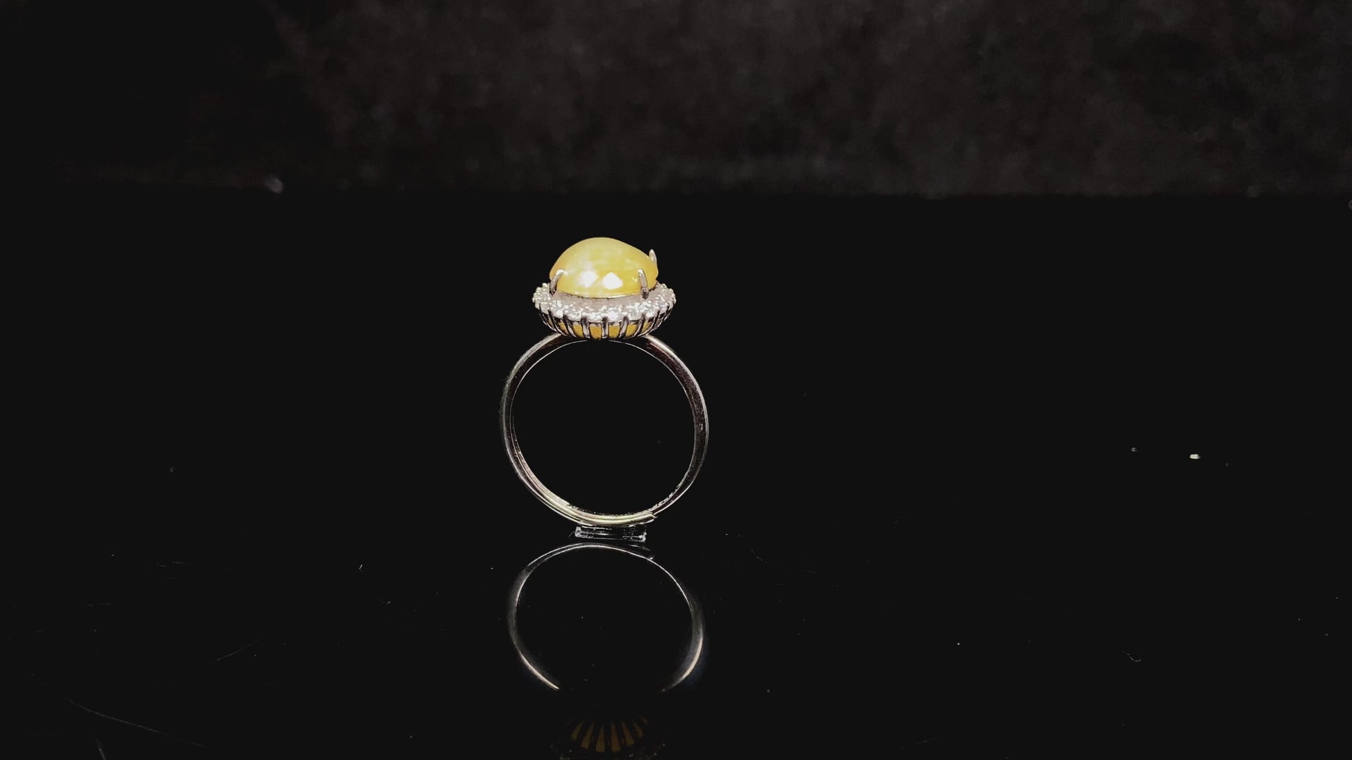 A warm honeyed glimmer jadeite ring.