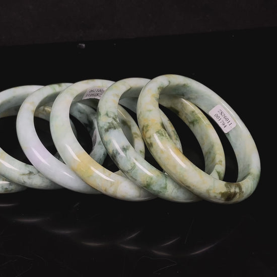 Mossy green with honeyed veins jadeite bangle.