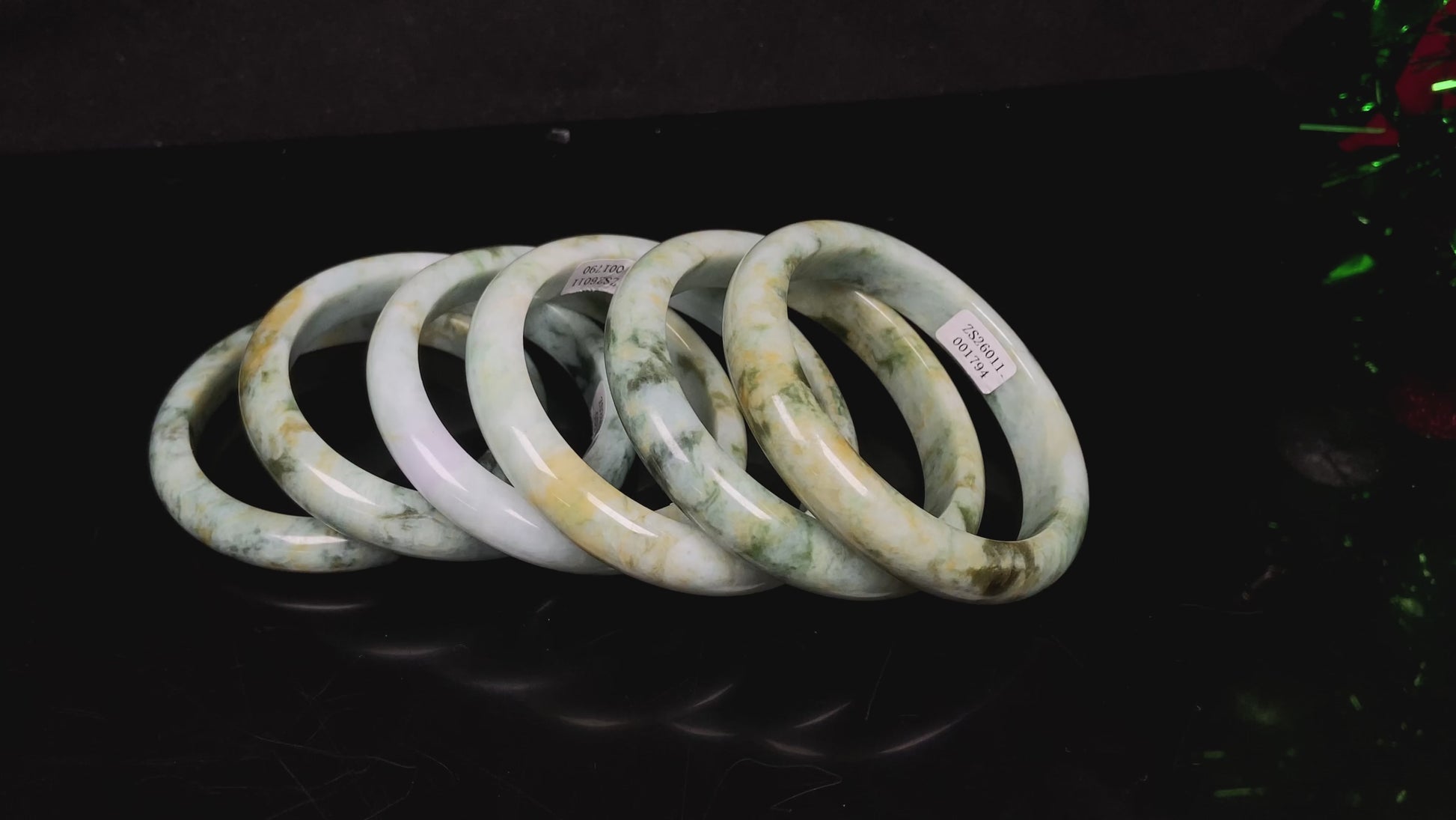 Mossy green with honeyed veins jadeite bangle.