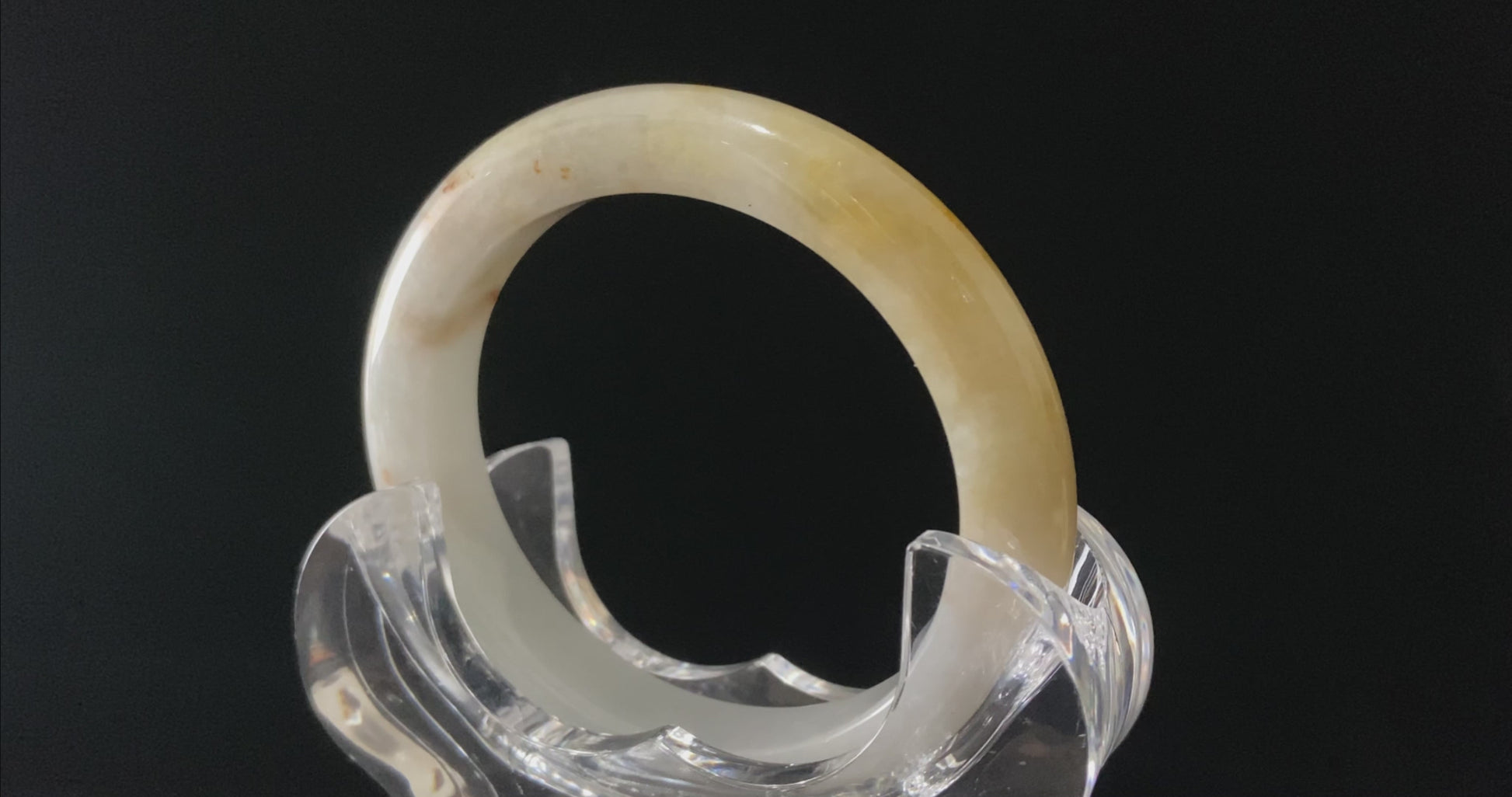 A golden honey veil jadeite bangle.