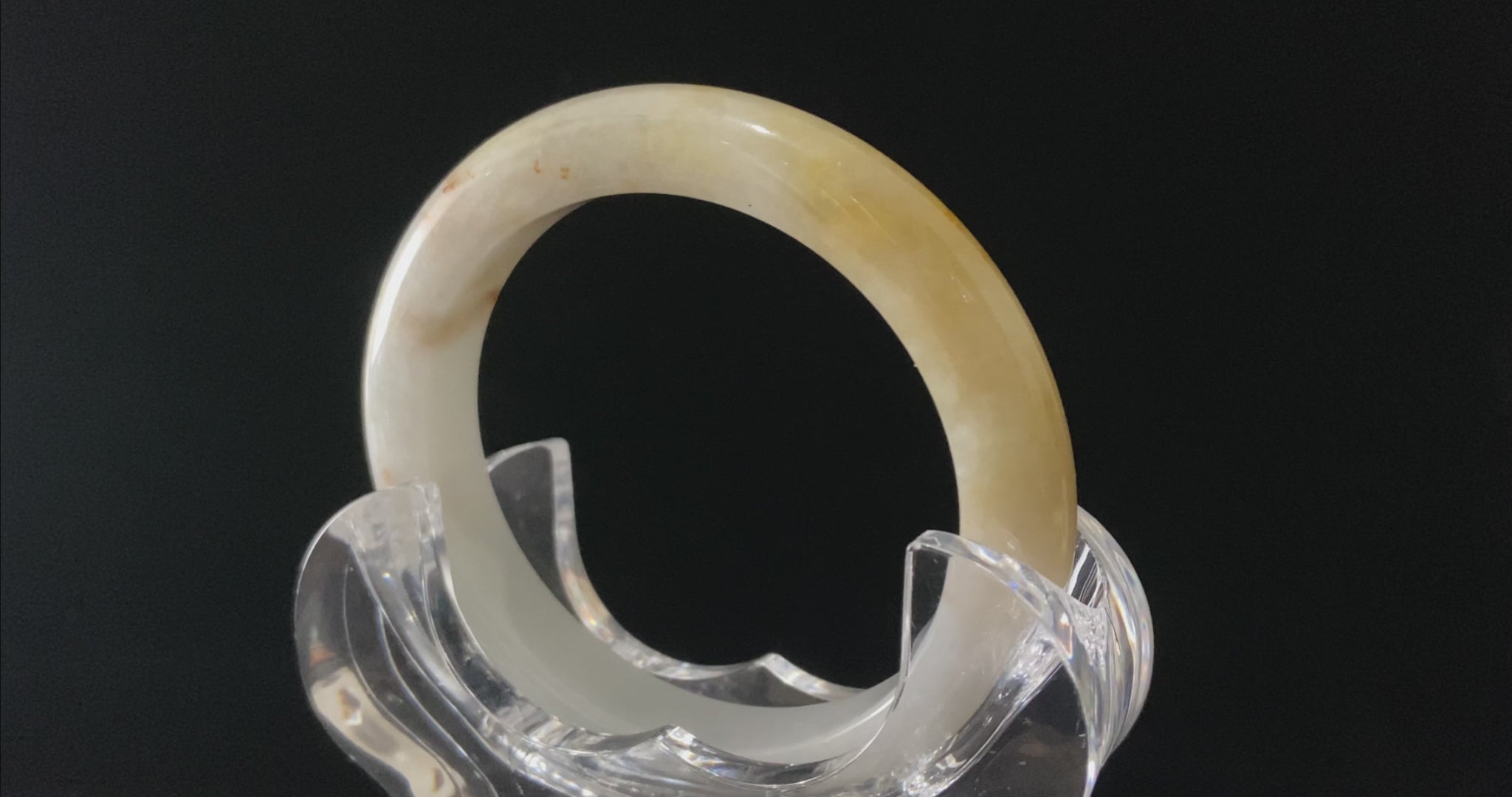 A golden honey veil jadeite bangle.