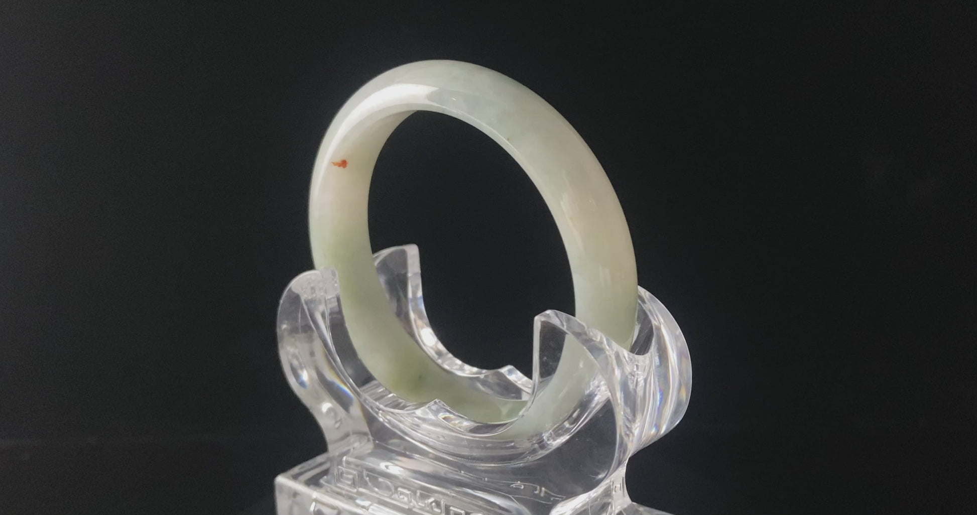 A milky mint honey spot jadeite bangle.