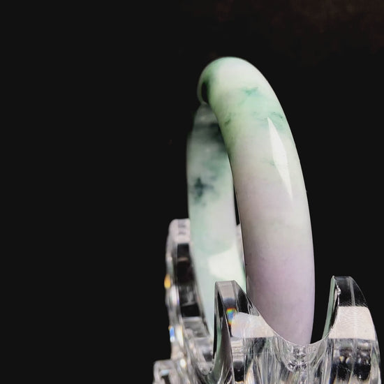 A misty green lavender jadeite bangle.