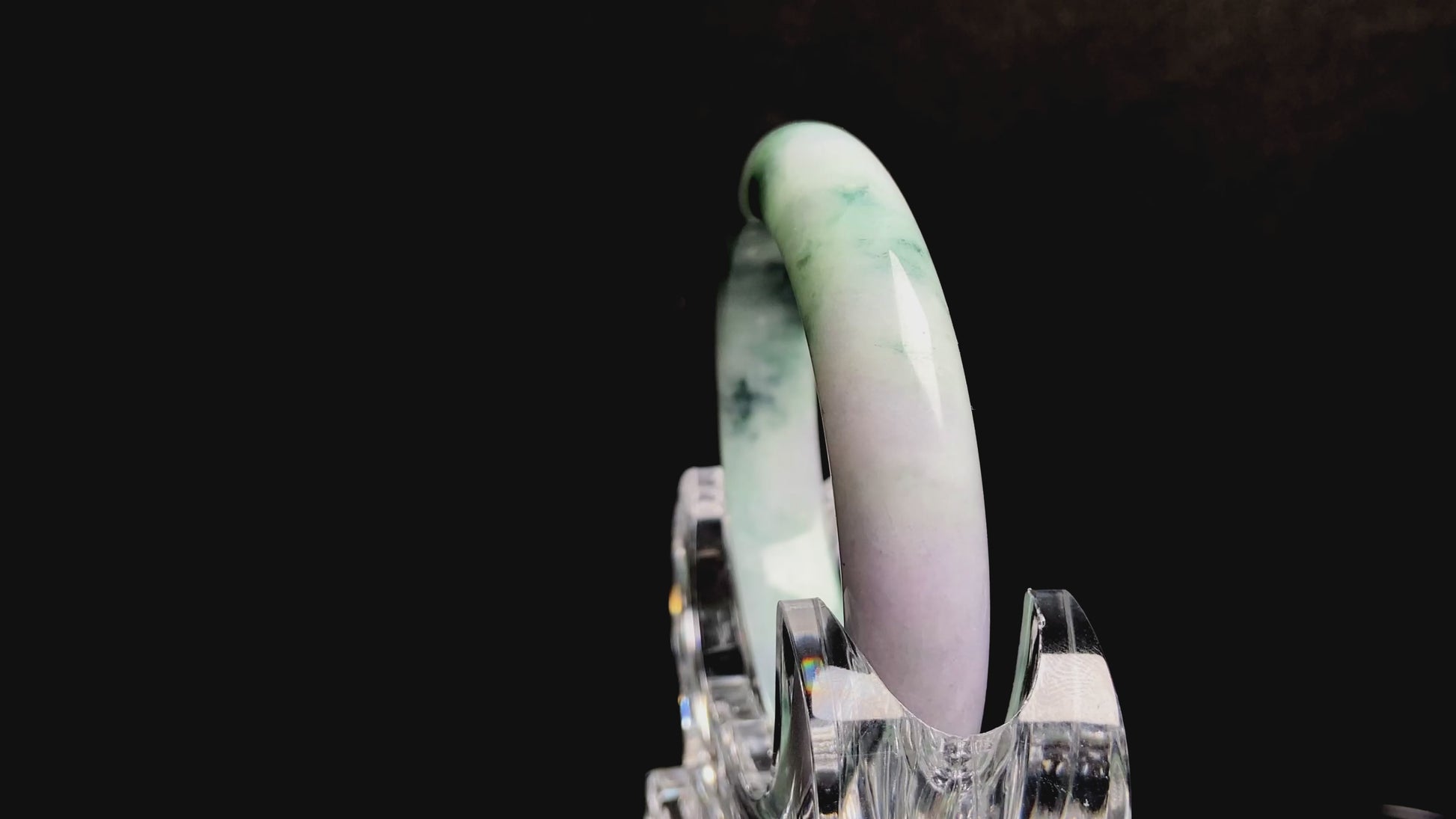 A misty green lavender jadeite bangle.